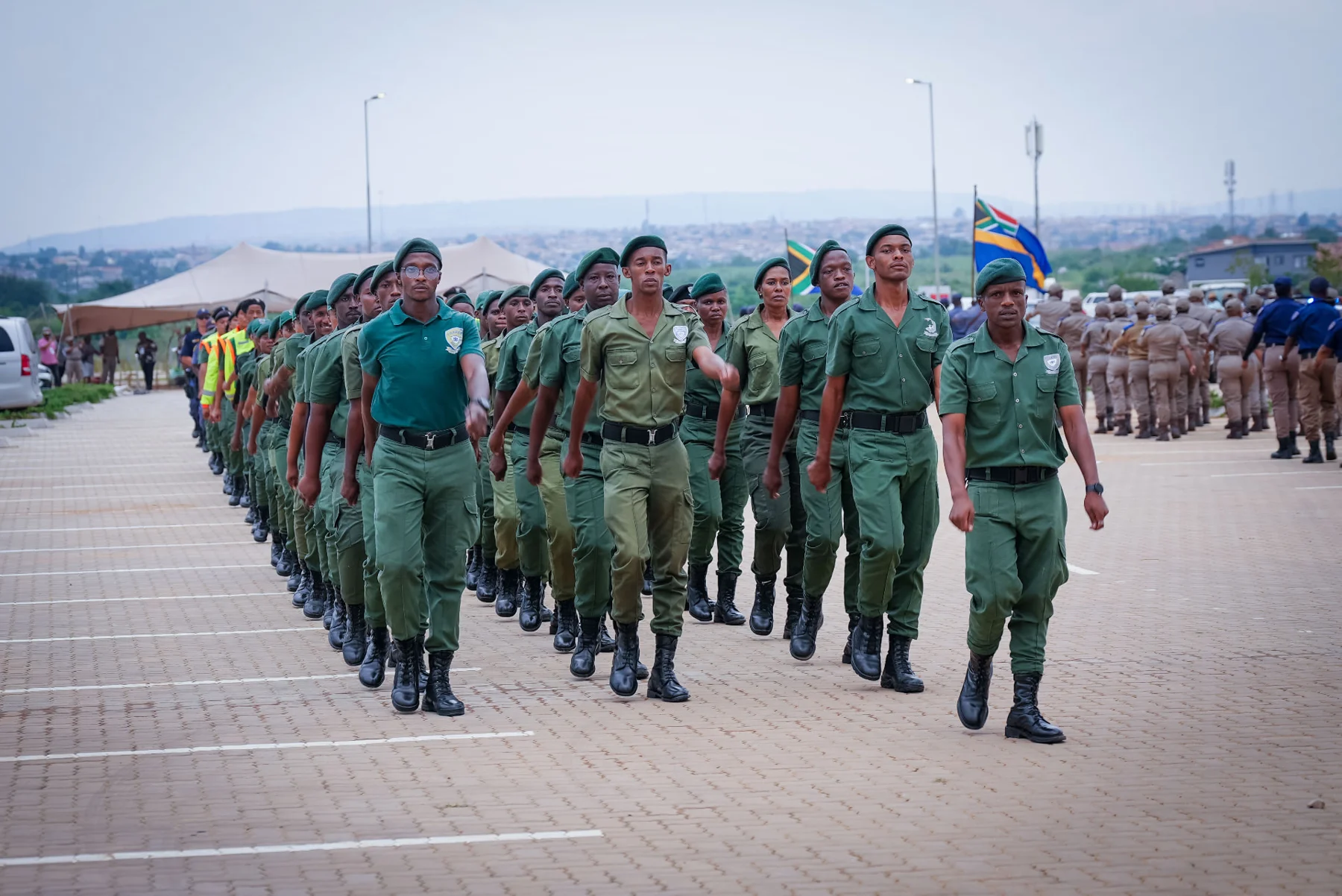 Uniformed participants marching in formation