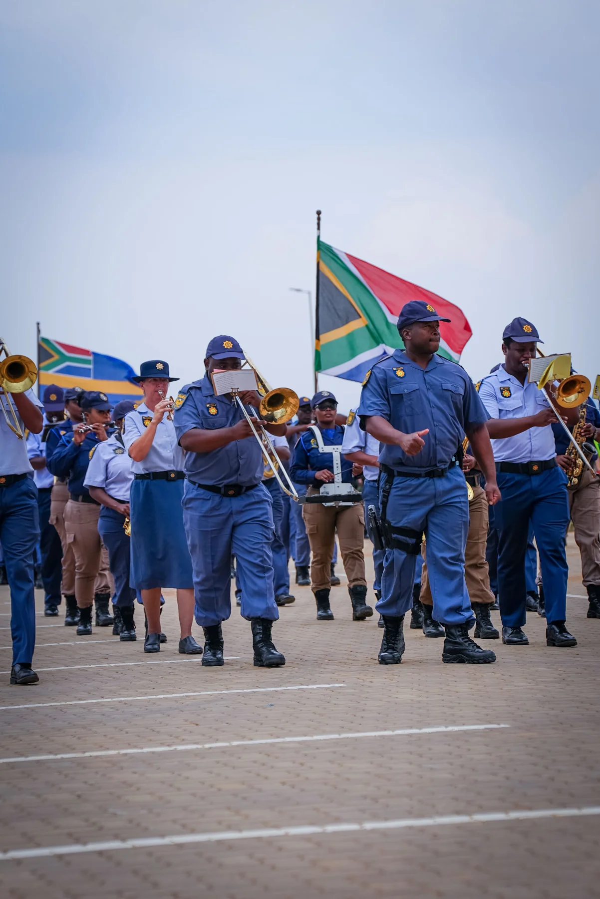 Police band performing with flags
