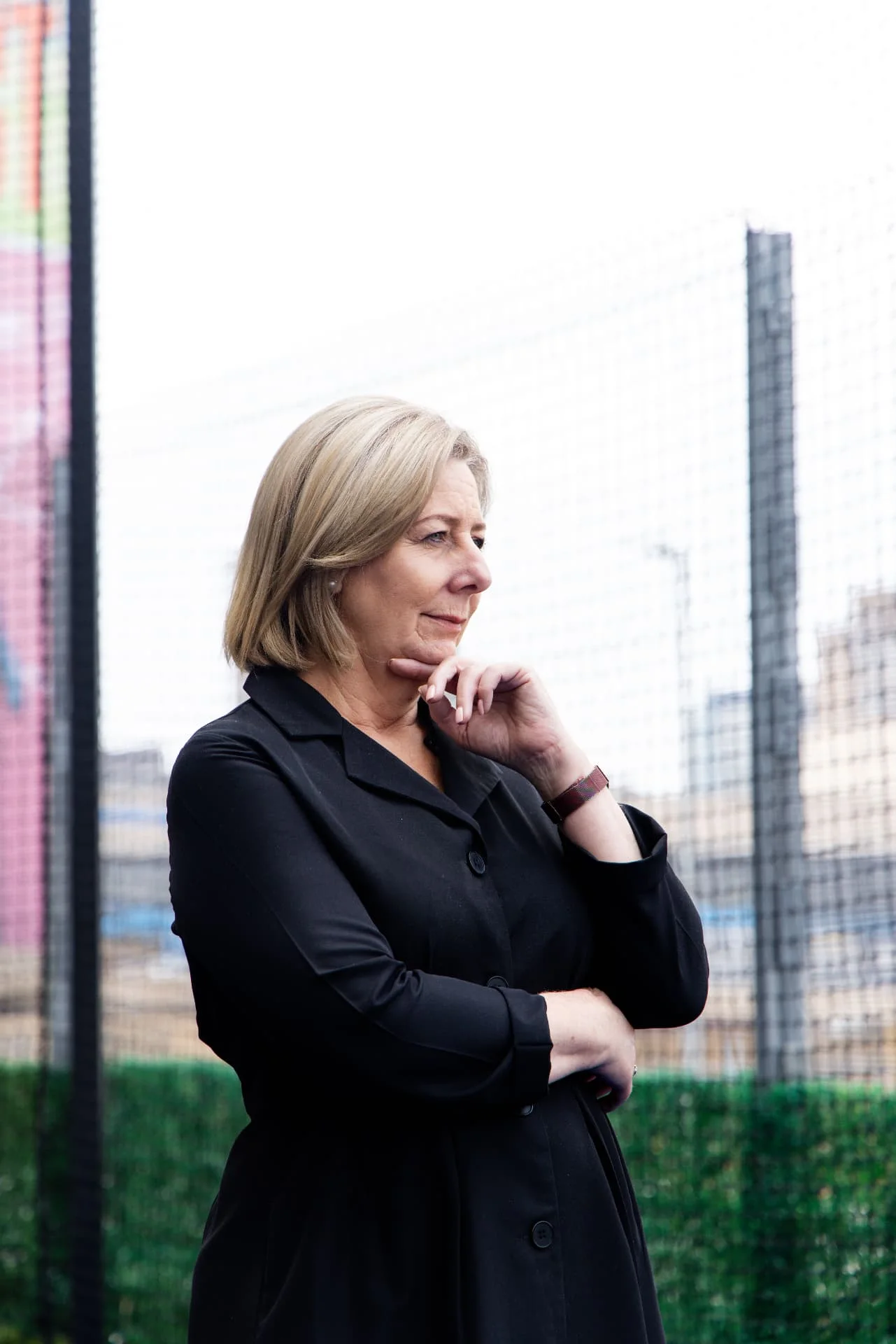 Ms Annette Lindeque in a thoughtful pose against the city skyline.
